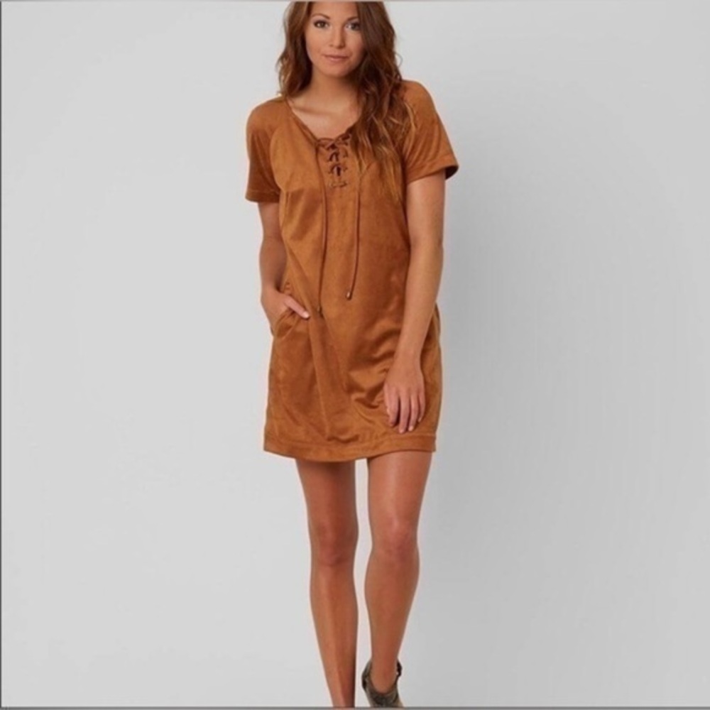 Patrons of Peace size medium brown thick material dress with 2 front pockets